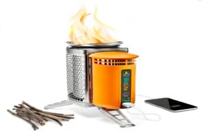 a portable stove with a fire on top