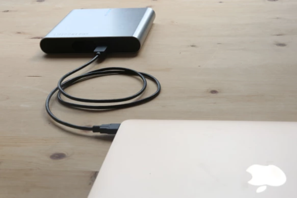 a black cable connected to a laptop