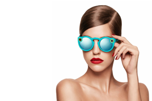 a woman wearing blue sunglasses