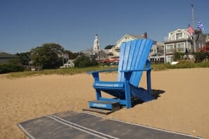 a blue chair on a beach