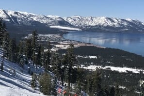 a view of a snowy mountain and a body of water