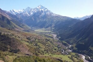 a valley with a mountain in the background