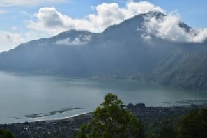 a body of water with mountains in the background