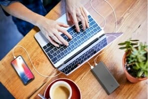 a person typing on a laptop