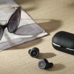 News: Bang & Olufsen Beoplay E8 2.0 sunglasses and earbuds on a table