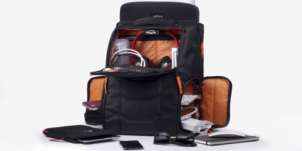 a backpack with electronics and glasses