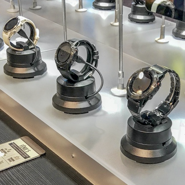 a group of smart watches on display