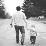 Father’s Day Deals & Offers a man and child walking on a road