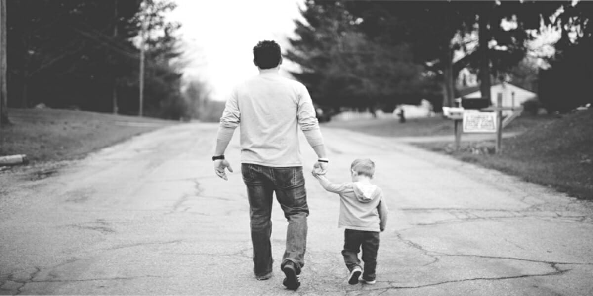 Father’s Day Deals & Offers a man and child walking on a road