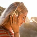 News: Bose Noise-Cancelling Headphones 700 a woman wearing headphones