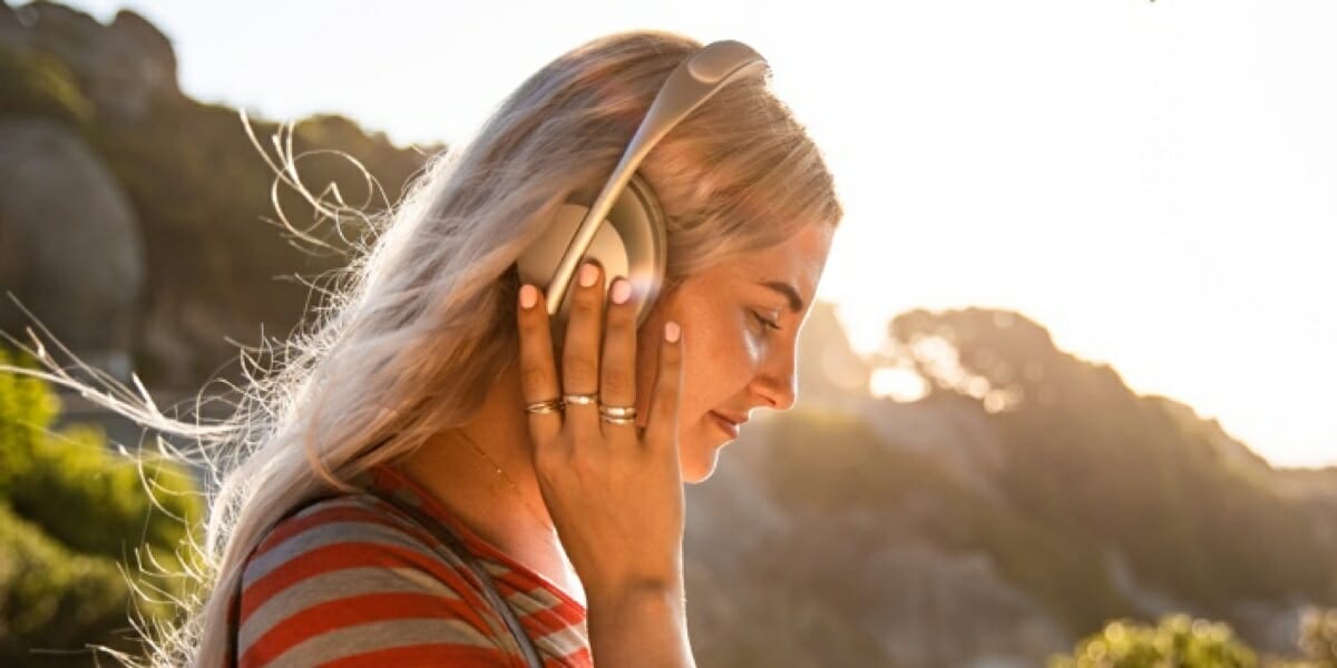 News: Bose Noise-Cancelling Headphones 700 a woman wearing headphones