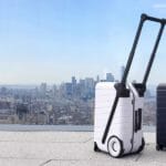 News: G-RO The SIX, a Carry-On Reinvented a couple of luggage on a balcony overlooking a city