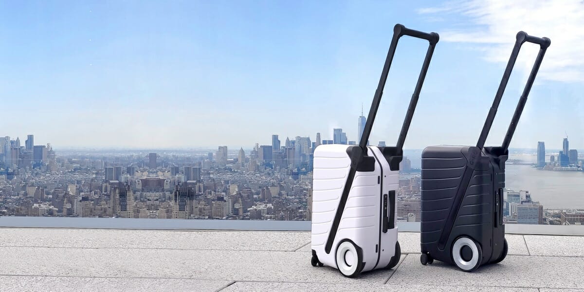 News: G-RO The SIX, a Carry-On Reinvented a couple of luggage on a balcony overlooking a city