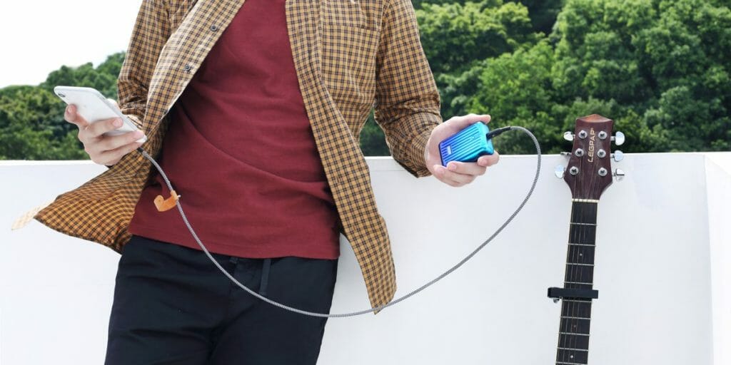 a person holding a blue device
