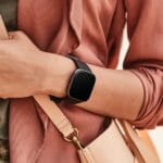 Fitbit Versa 2 Smartwatch for Healthier Travel fitbit versa 2 in black being worn by female. {Tech} for Travel. https://techfortravel.wpengine.com