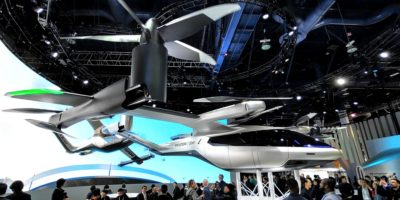 People carrying drone for Uber.