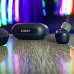 Review: Edifier X3 Wireless Earbuds are a Perfect Fit for any Traveller a pair of black wireless earbuds on a wooden surface