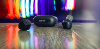 Review: Edifier X3 Wireless Earbuds are a Perfect Fit for any Traveller a pair of black wireless earbuds on a wooden surface