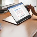 Business Travel has a New Look – Lenovo ThinkPad X1 Titanium YOGA a person using a stylus on a laptop