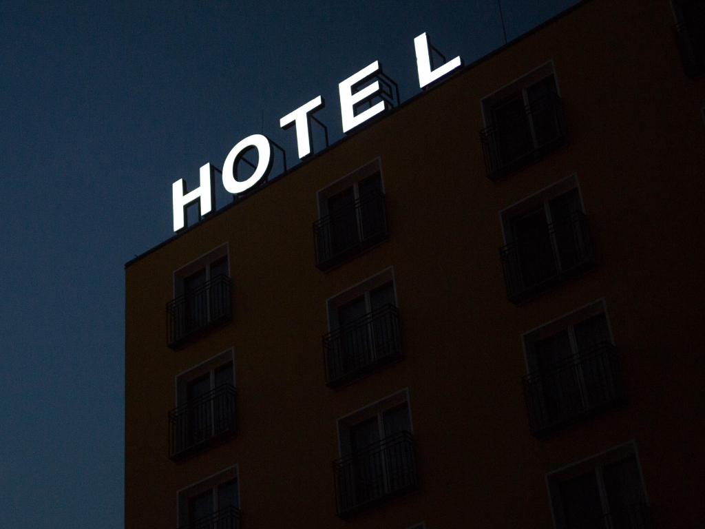 a hotel sign on top of a building
