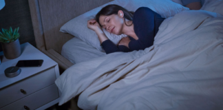 Get a Better Nights Sleep on your Next Hotel Stay with the New Bose Sleepbuds 2 a woman sleeping in bed