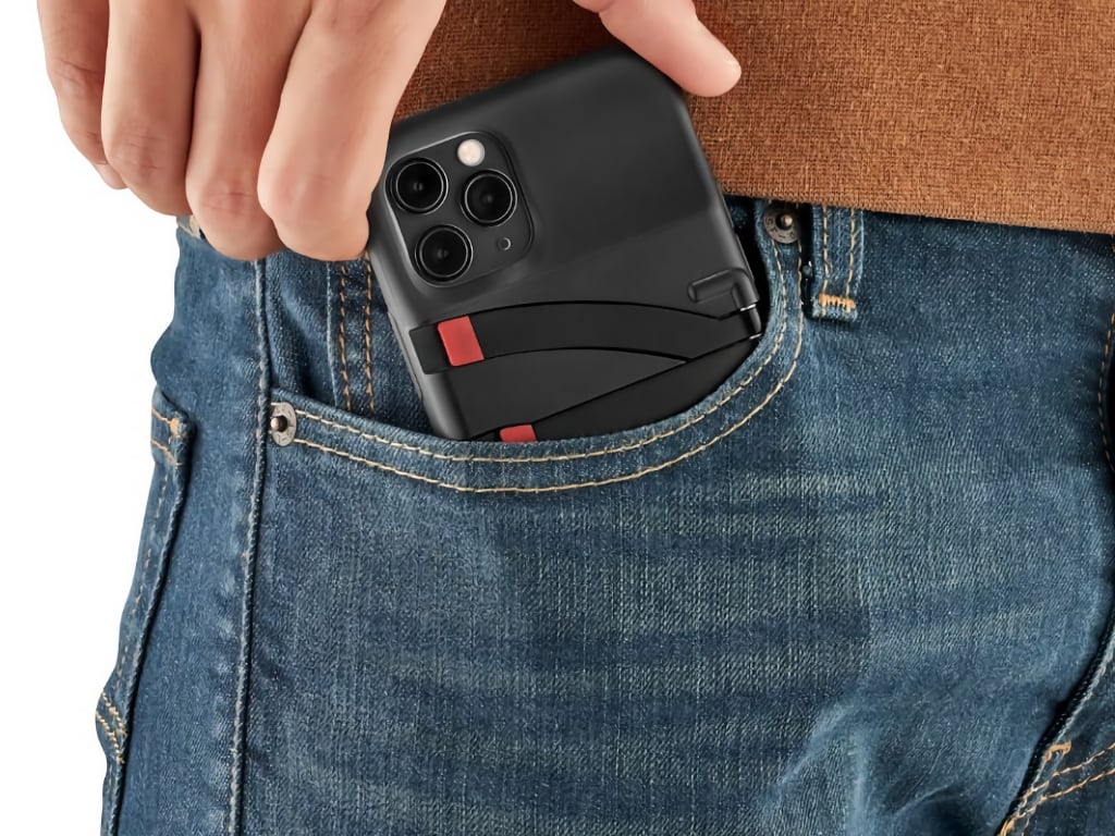 a person putting a phone in a pocket