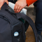 RiutBag R15.4 Backpack Next Gen of Secure Backpack Travel a person holding a laptop in their backpack