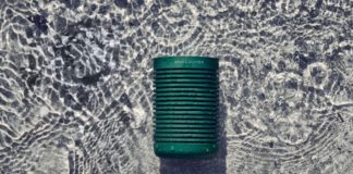 Indoor Sounds Made for the Great Outdoors with the New B&O Beosound Explore Portable Speaker a green can on the water