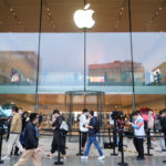 New Apple iPhone 13 Pro & Pro Max – Overview & Specifications a group of people in front of a glass building