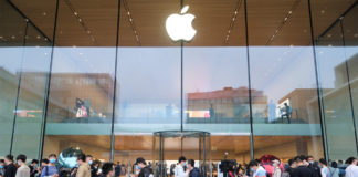 New Apple iPhone 13 Pro & Pro Max – Overview & Specifications a group of people in front of a glass building