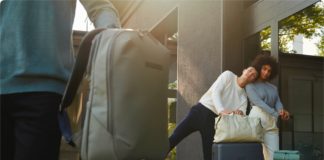 Best Travel Tech Deals: Up to 50% Off Horizn Studios Luggage a man and woman standing next to luggage