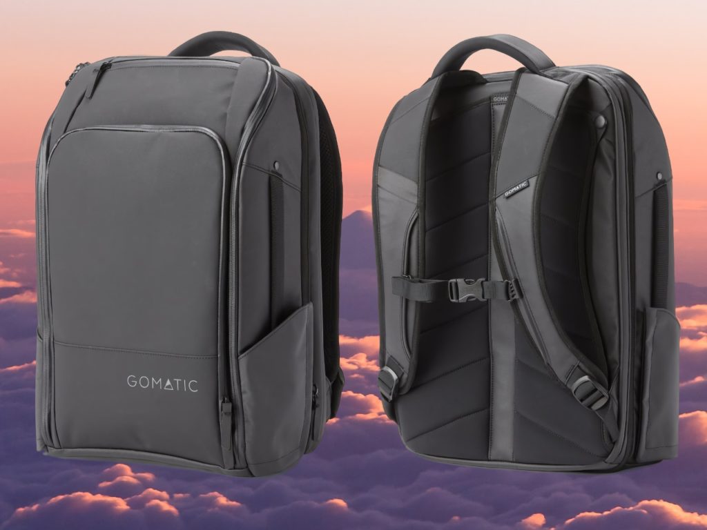 a black backpacks with a mountain in the background