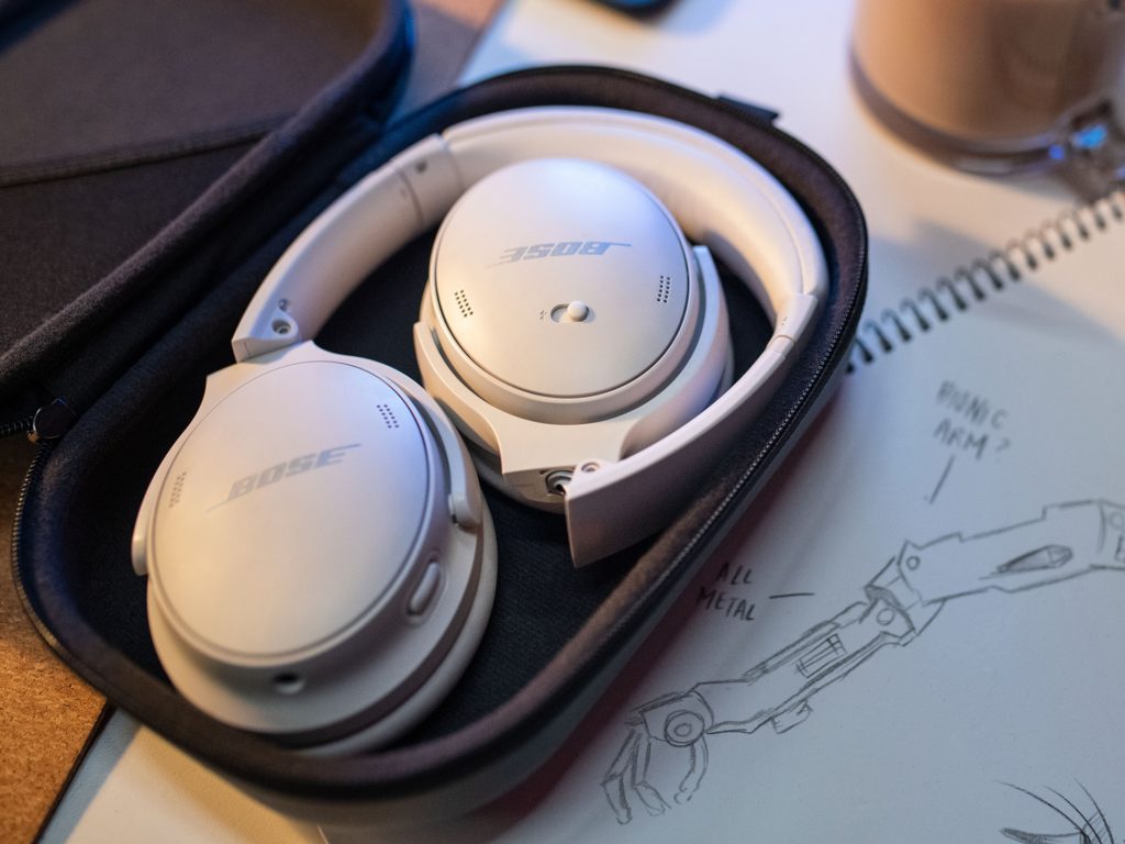 a white headphones in a case