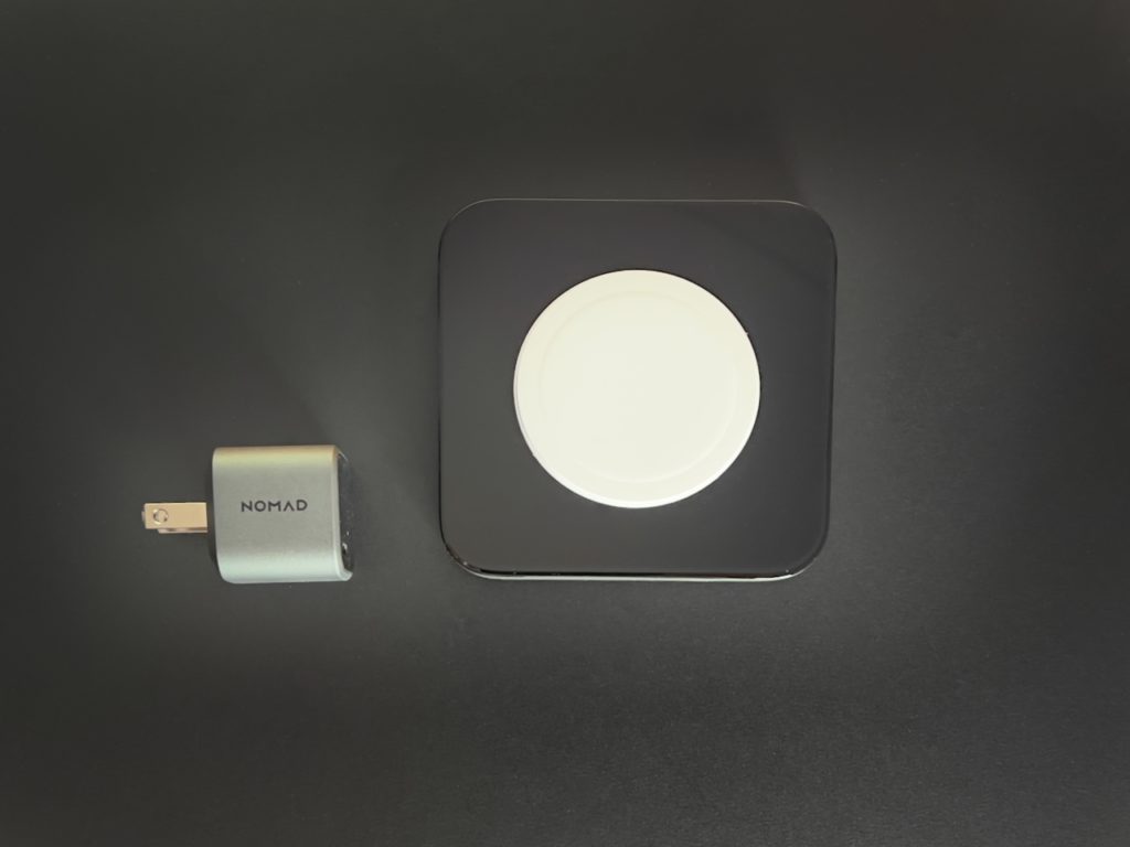 a black square with a white circle on it next to a gray square