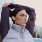 Sony LinkBuds Earbuds Break Headphone Blueprint with Unique Ring Design a woman wearing a wireless earbuds and a purple vest