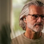 CES 2024: BREGGZ Earbuds are the Future of Custom-Fit Luxury Audio a man wearing glasses and a grey beard