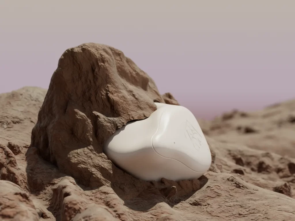 a white object in a rock. CES 2024 News BREGGZ Earbuds.  {Tech} for Travel. https://techfortravel.co.uk