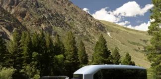 CES 2024: Pebble Flow is the Revolutionary Electric RV Redefining Outdoor Adventures a black car and a bus parked in a grassy area. CES 2024 News Pebble Flow Electric RV. {Tech} for Travel. https://techfortravel.co.uk