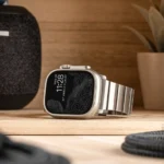Back in Stock: Why the Nomad Goods Titanium Band is the Perfect Upgrade for Your Apple Watch a smart watch on a table. Nomad Goods Titanium Band