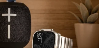 Back in Stock: Why the Nomad Goods Titanium Band is the Perfect Upgrade for Your Apple Watch a smart watch on a table. Nomad Goods Titanium Band