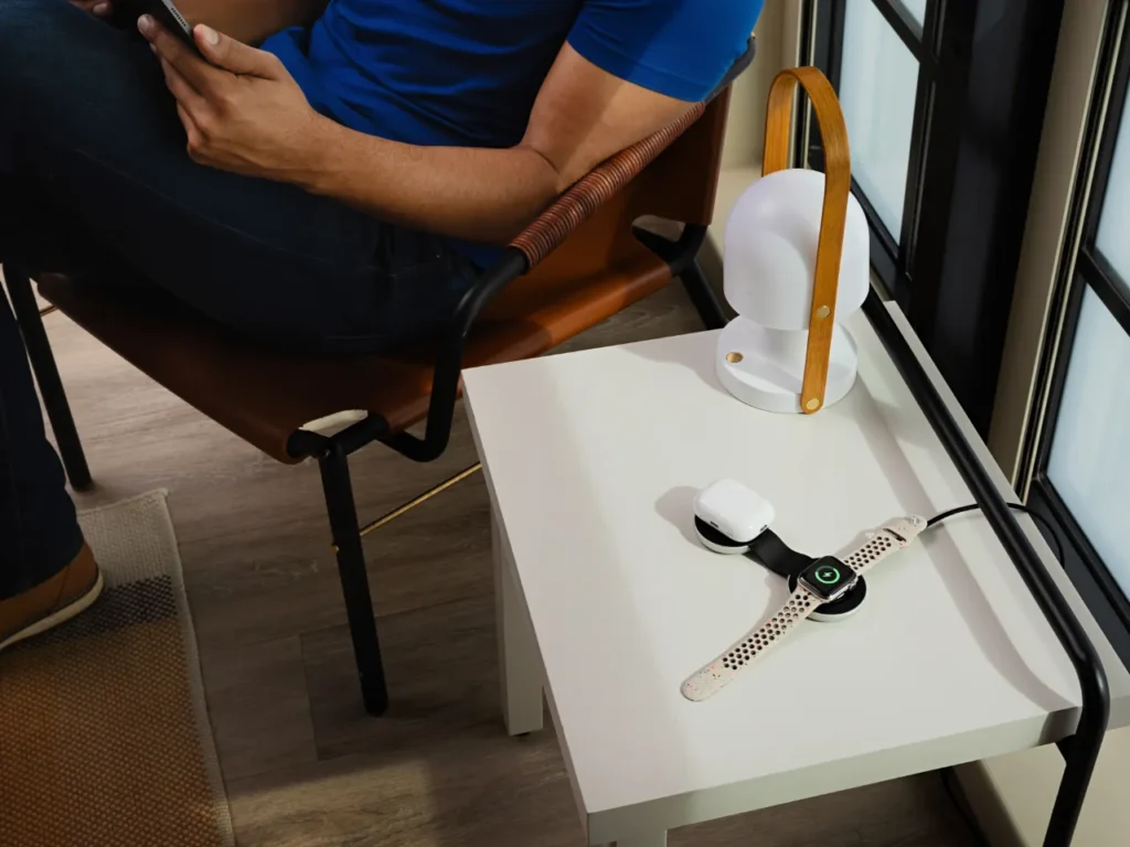 a man sitting in a chair holding a phone.  Twelve South ButterFly MagSafe Charger.  Father's Day Gifts 2024.  {Tech} for Travel. https://techfortravel.co.uk