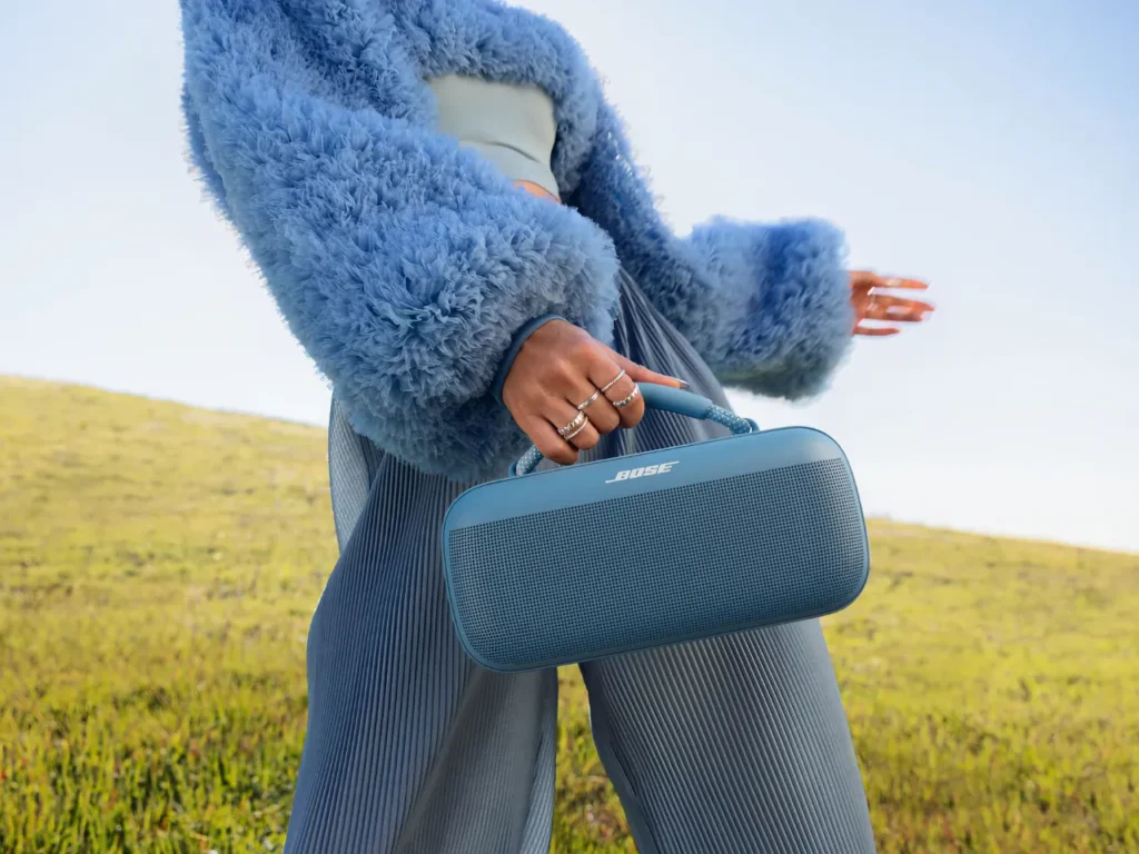 a person holding a blue bag. Bose SoundLink Max Portable Speaker.  {Tech} for Travel. https://techfortravel.co.uk