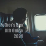 Jetsetter Essentials: 15 Father’s Day Gifts for the Globetrotting Dad a man and child looking out of an airplane window. Father's Day Gift Ideas