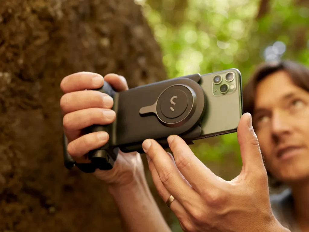 a person holding a camera. ShifCam Pro Grip Father's Day Gifts 2024.  {Tech} for Travel. https://techfortravel.co.uk