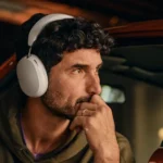 Experience Travel with the New Sonos Ace Headphones a man wearing headphones. Sonos Ace Headphones