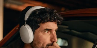 Experience Travel with the New Sonos Ace Headphones a man wearing headphones. Sonos Ace Headphones
