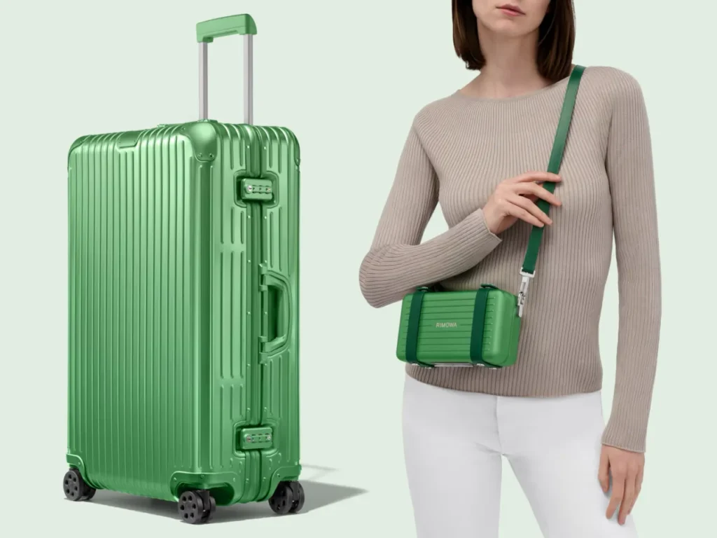 a woman with a green suitcase. Rimowa Emerald Green Collection.  {Tech} for Travel. https://techfortravel.co.uk