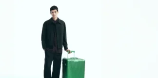 Travel in Elegance with the Rimowa Emerald Green Collection a man standing with a green suitcase. Rimowa Emerald Green Collection