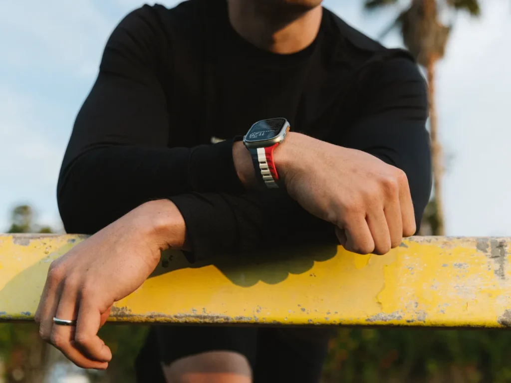 a man wearing a watch. Nomad Goods Summer sports Apple Watch band. {Tech} for Travel. https://techfortravel.co.uk