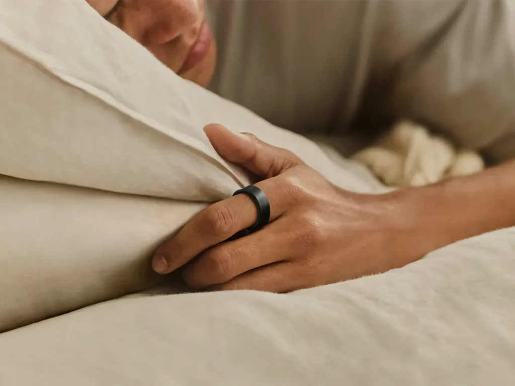 a person sleeping on a bed. Samsung Galaxy Ring.  {Tech} for Travel. https://techfortravel.co.uk